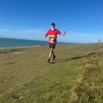 Lewes AC Member Robin Edwards enjoying the 2025 Beachy Head Half Marathon