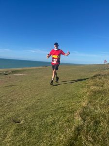Lewes AC Member Robin Edwards enjoying the 2025 Beachy Head Half Marathon
