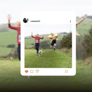 Runners in festive attire leap for joy during 2025 The Lewes Downland Santa Run