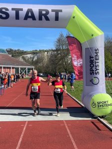 Lewes AC's Adrian and Liz at the finish line of the 2026 Lewes AC Easter 10k