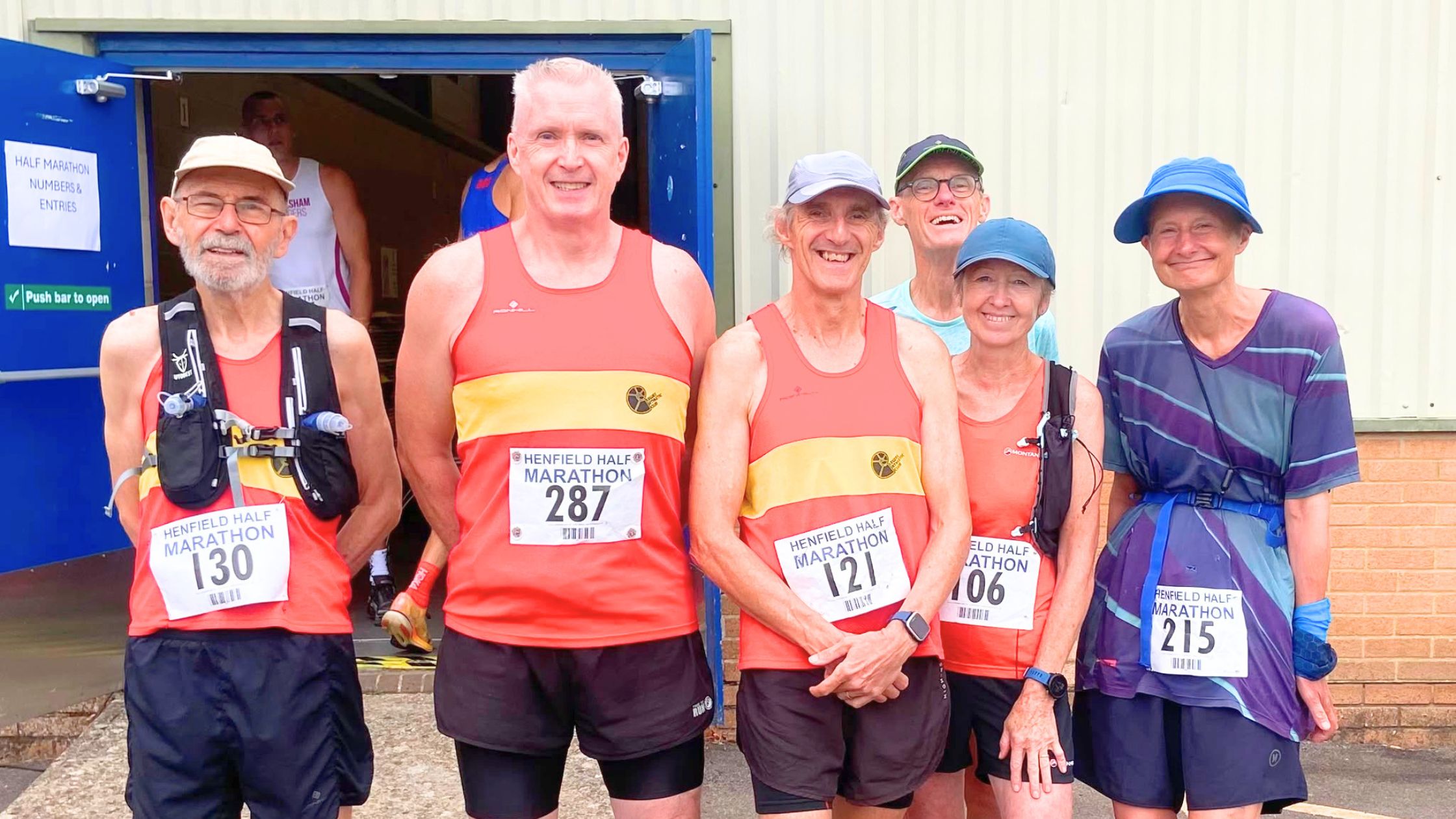 2026 Henfield Half Six Lewes AC members lined up at the start of the 2026 Henfield Half Marathon